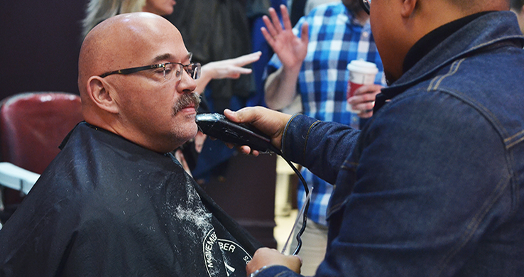 Man having moustache shaved off