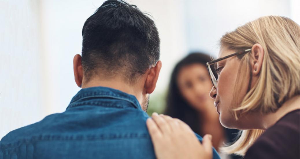 Woman consoling a man