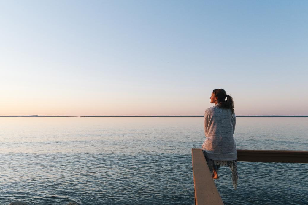 Woman sitting on dock