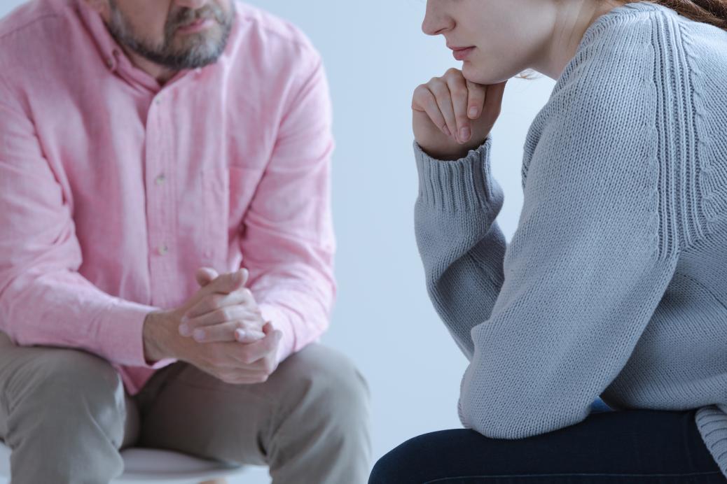 Man listening to a women