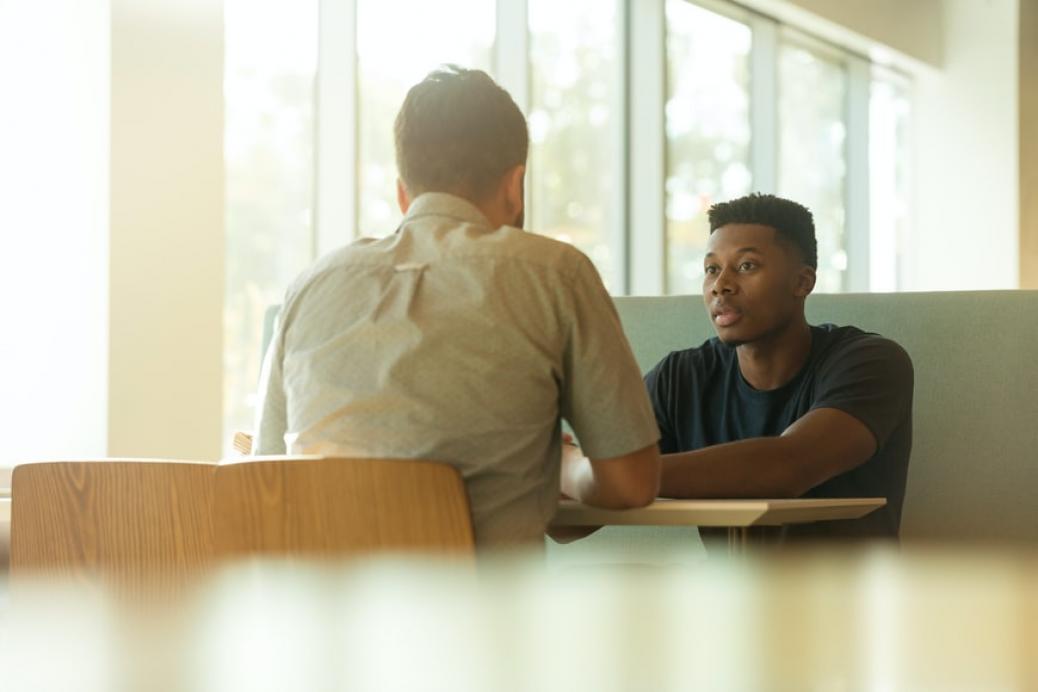 Two men talking