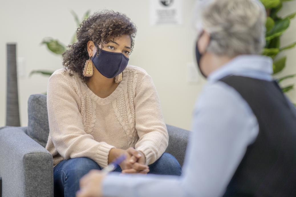 Woman speaking with chatting with another woman