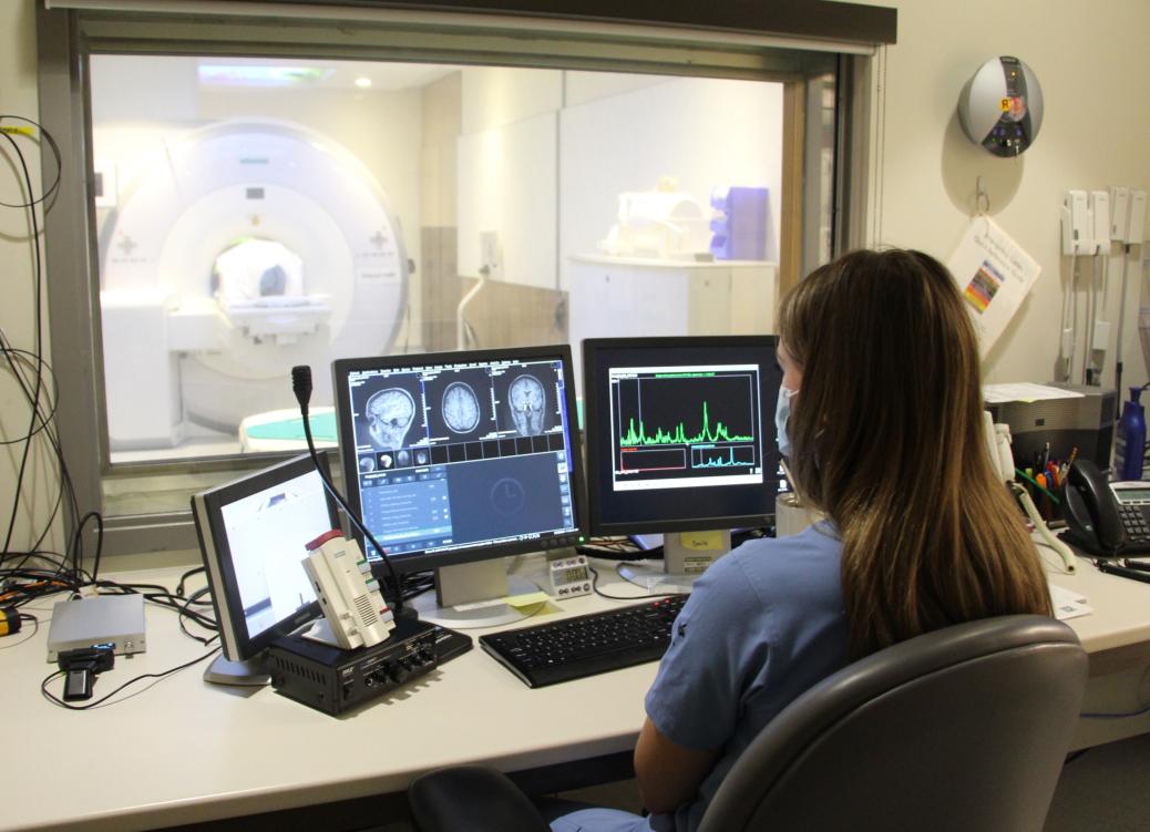 Researcher comparing the structure and function of the brain in individuals who have suicidal thoughts