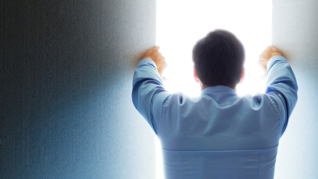 Man holding doors wide open