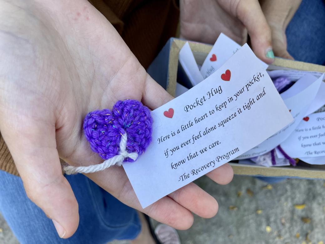 Holding a "pocket hug" - a crocheted heart-shaped token