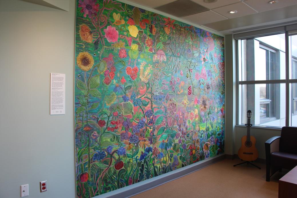 The completed mural, now hung on the wall. The title is "Tangled Garden"