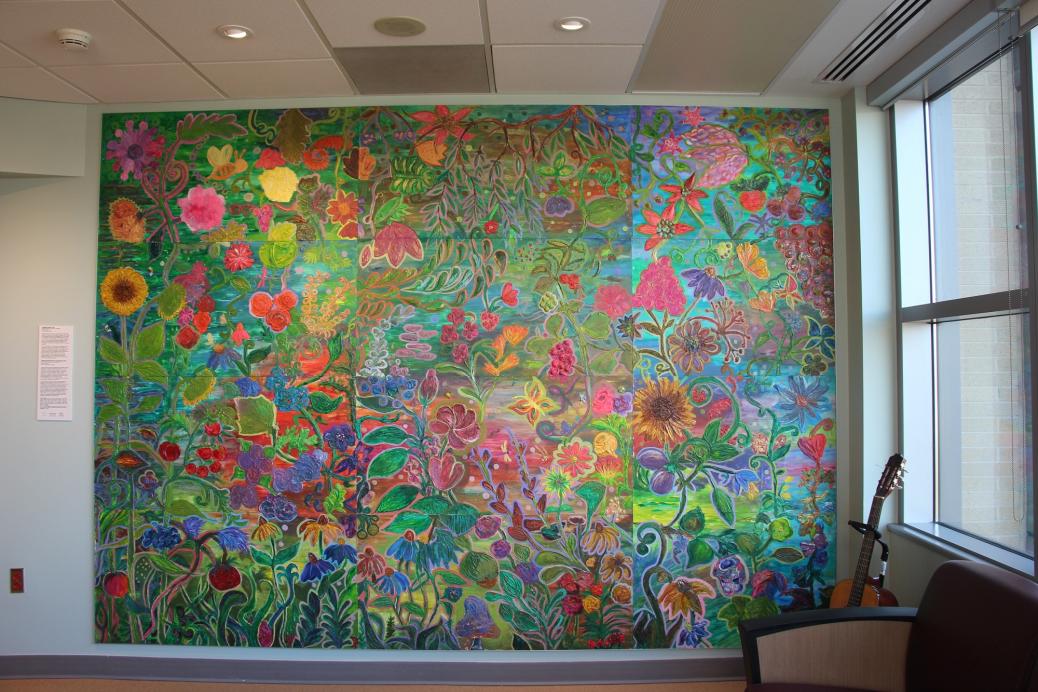 The completed mural, now hung on the wall. The title is "Tangled Garden"