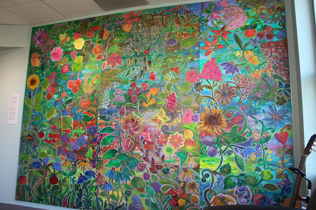 The completed mural, now hung on the wall. The title is "Tangled Garden"