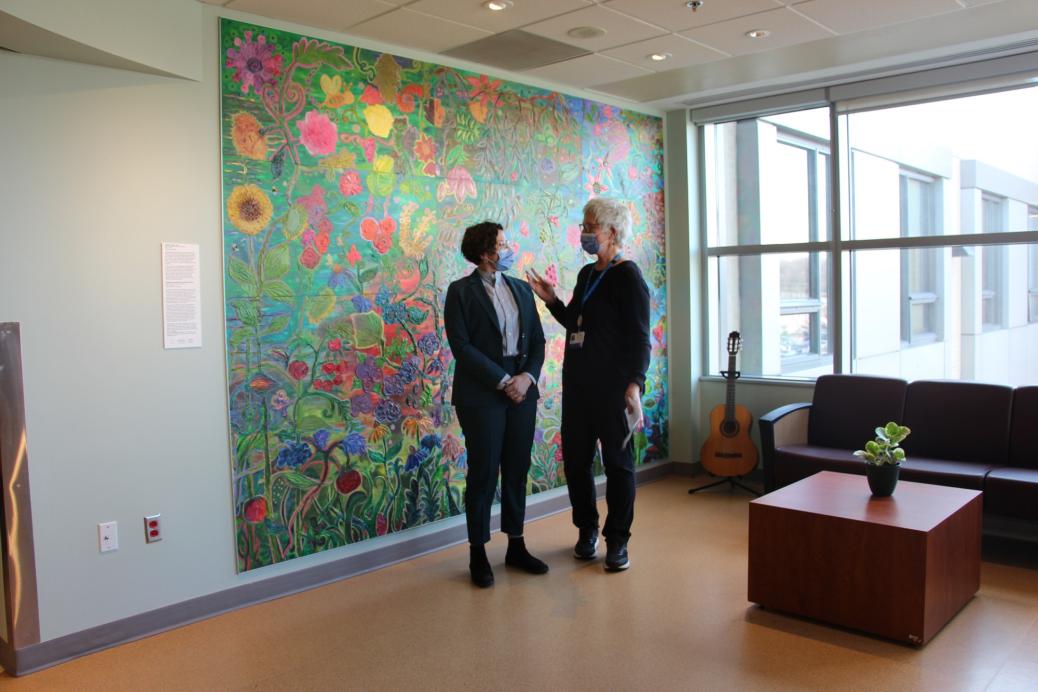 The completed mural, now hung on the wall. The title is "Tangled Garden"