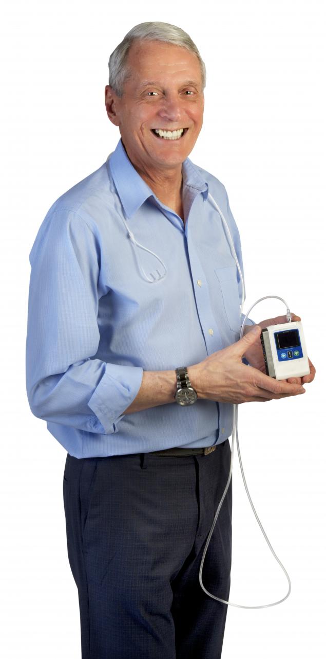 Photo of Barry Simms holding a portable sleep device