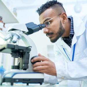 Researcher looking through stethoscope