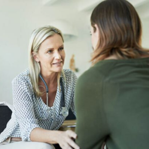 Physician speaking with patient