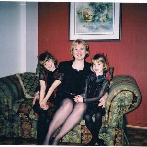 Julia with her twin sister and mom
