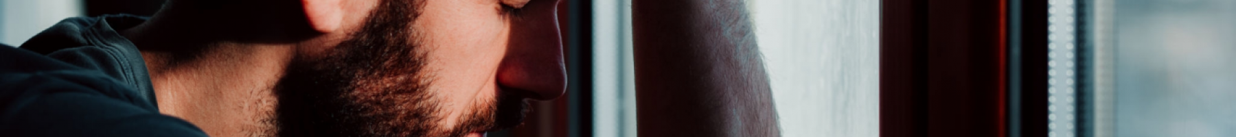 Forensic Family Support Groups Man with head leaning on window