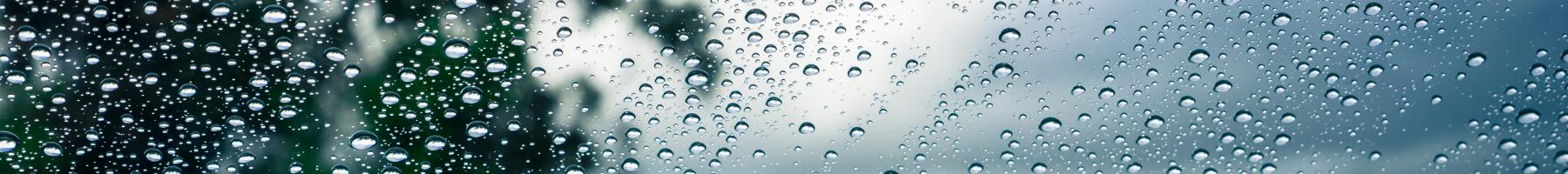 A photo of a rain falling on window A photo of a rain falling on window