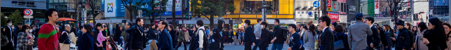 People crossing busy street