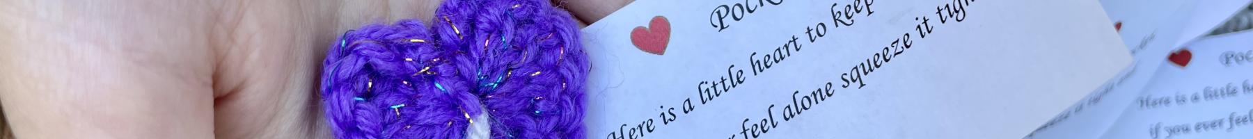 Holding a "pocket hug" - a crocheted heart-shaped token