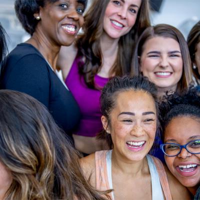 group of women smiling and laughing