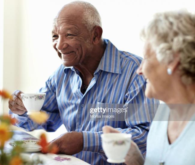 Senior man having tea