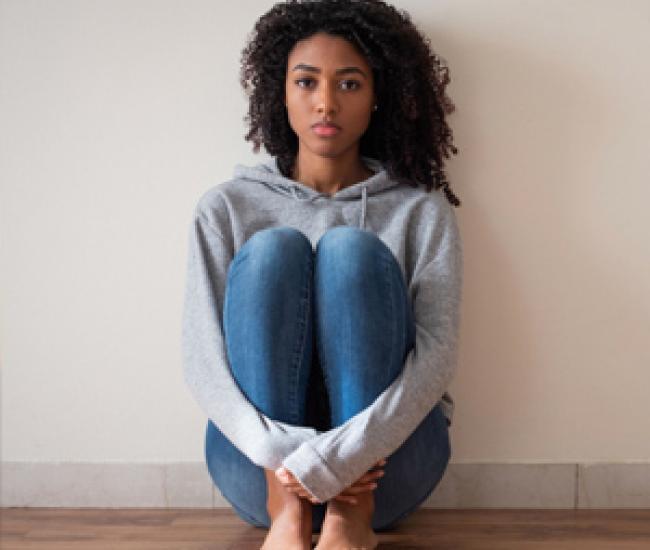 Young lady sitting on floor