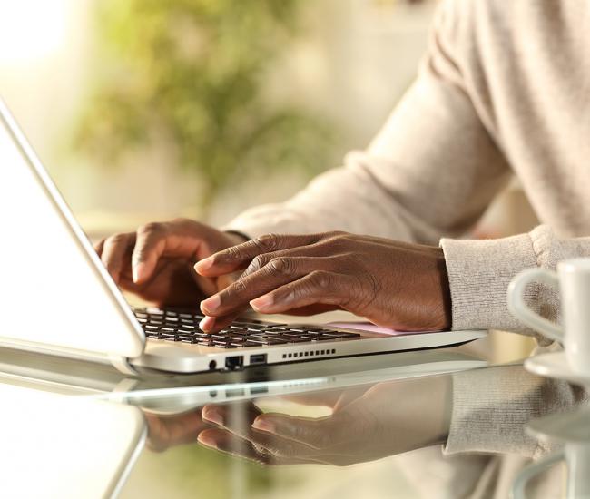 Person typing on laptop