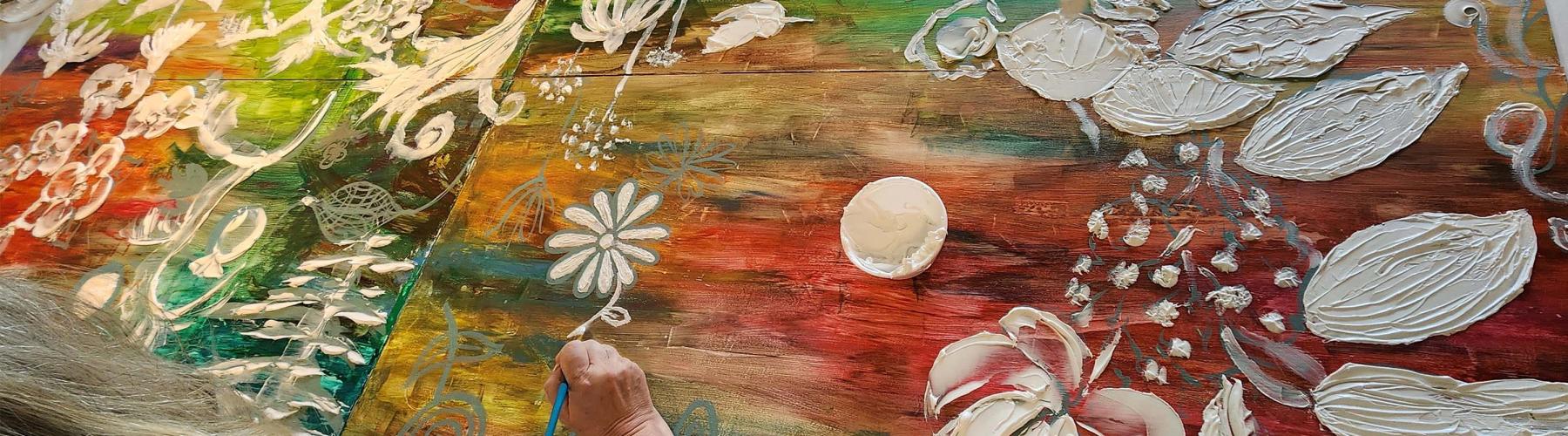 Person working on painting