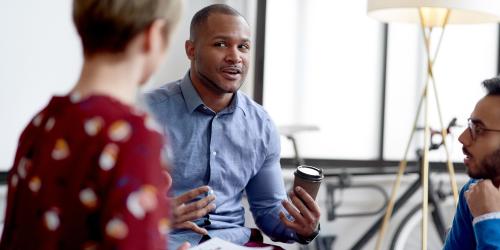 Three people having a conversation