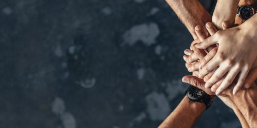 Hands on top of one another