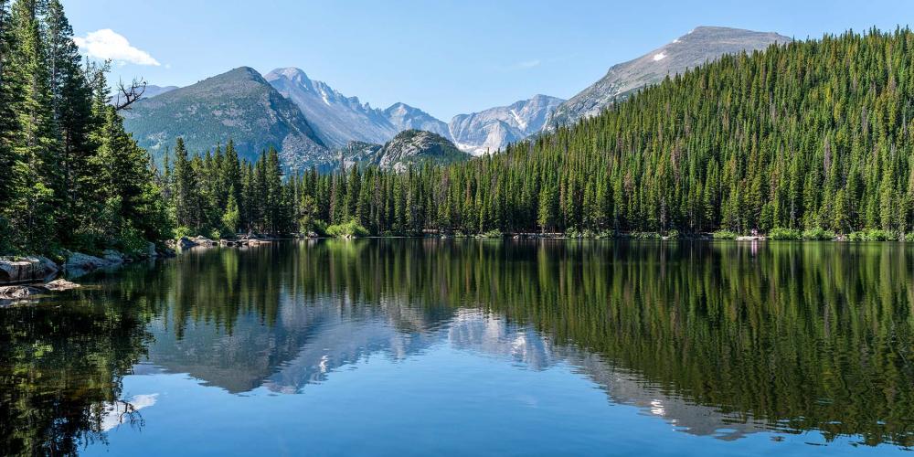 Nature scene of a lake with mountains in the background