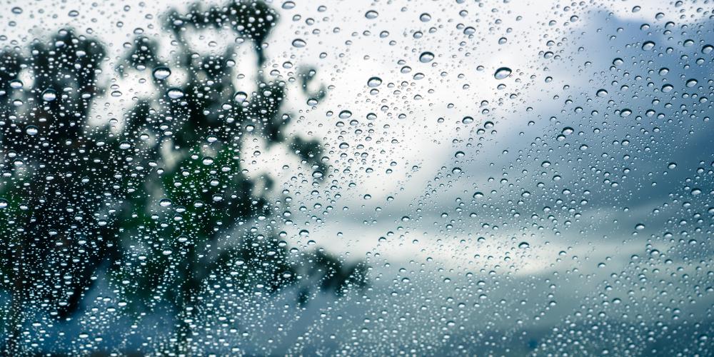 A photo of a rain falling on window