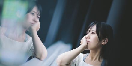 Woman looking out a window 