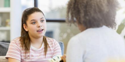 Young girl speaking to therapist