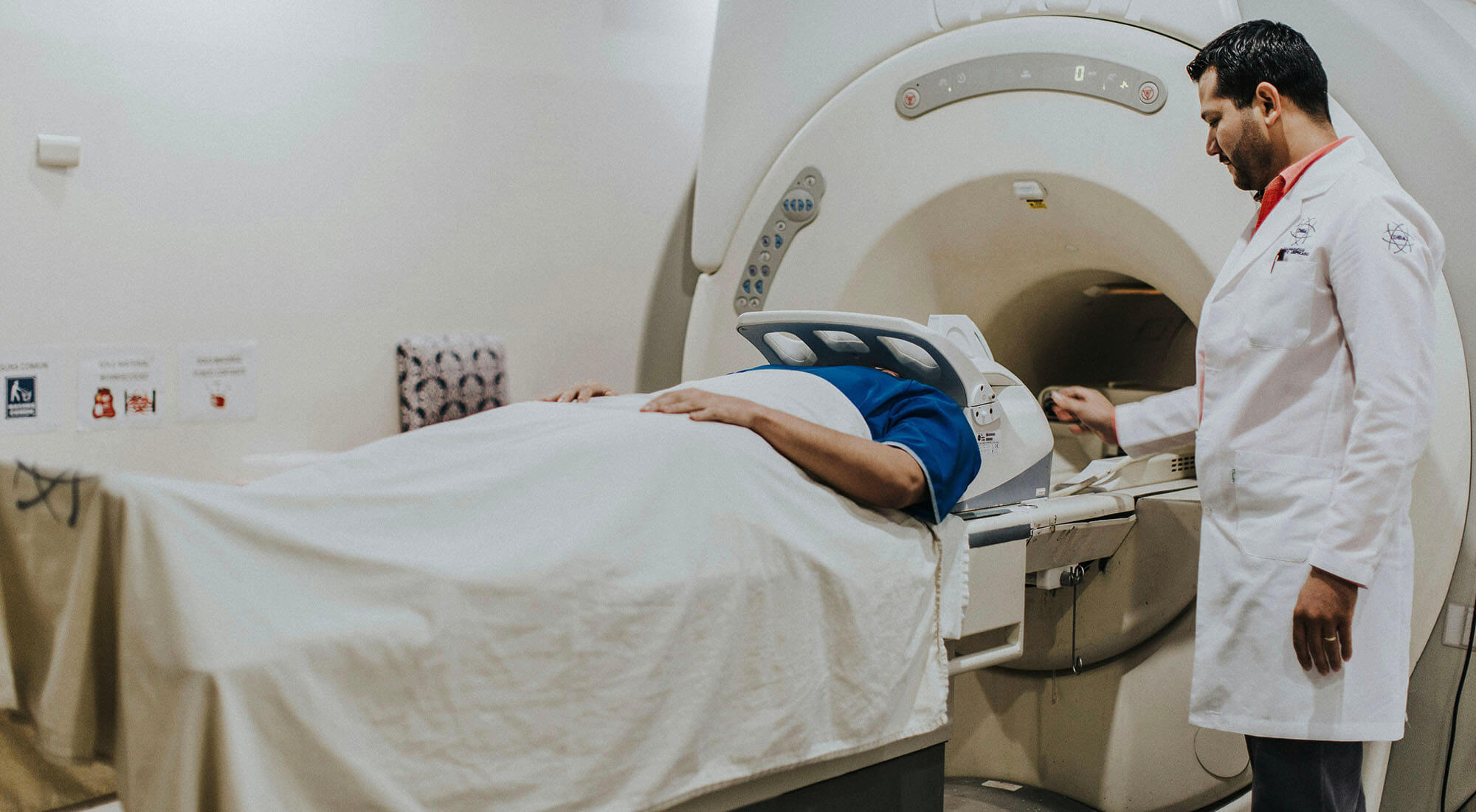 A patient lies on a scanning bed