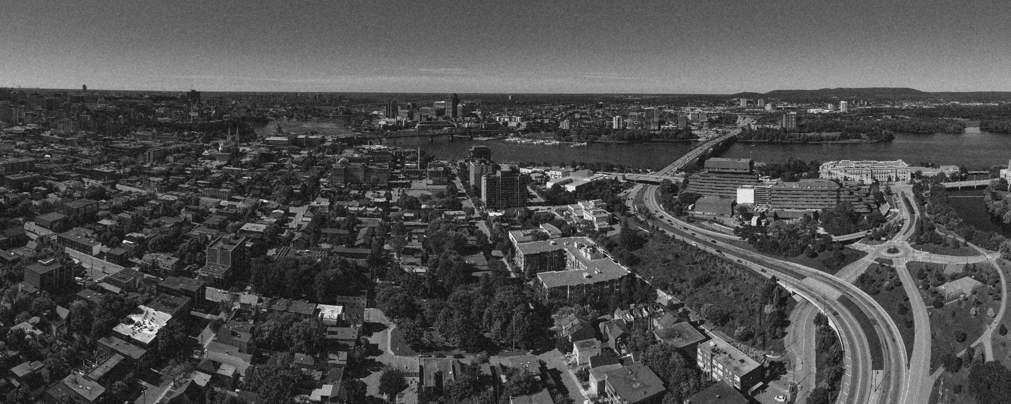 Birds eye view of the city of Ottawa, looking out at the Ottawa River, Parliament Hill and surrounding areas.